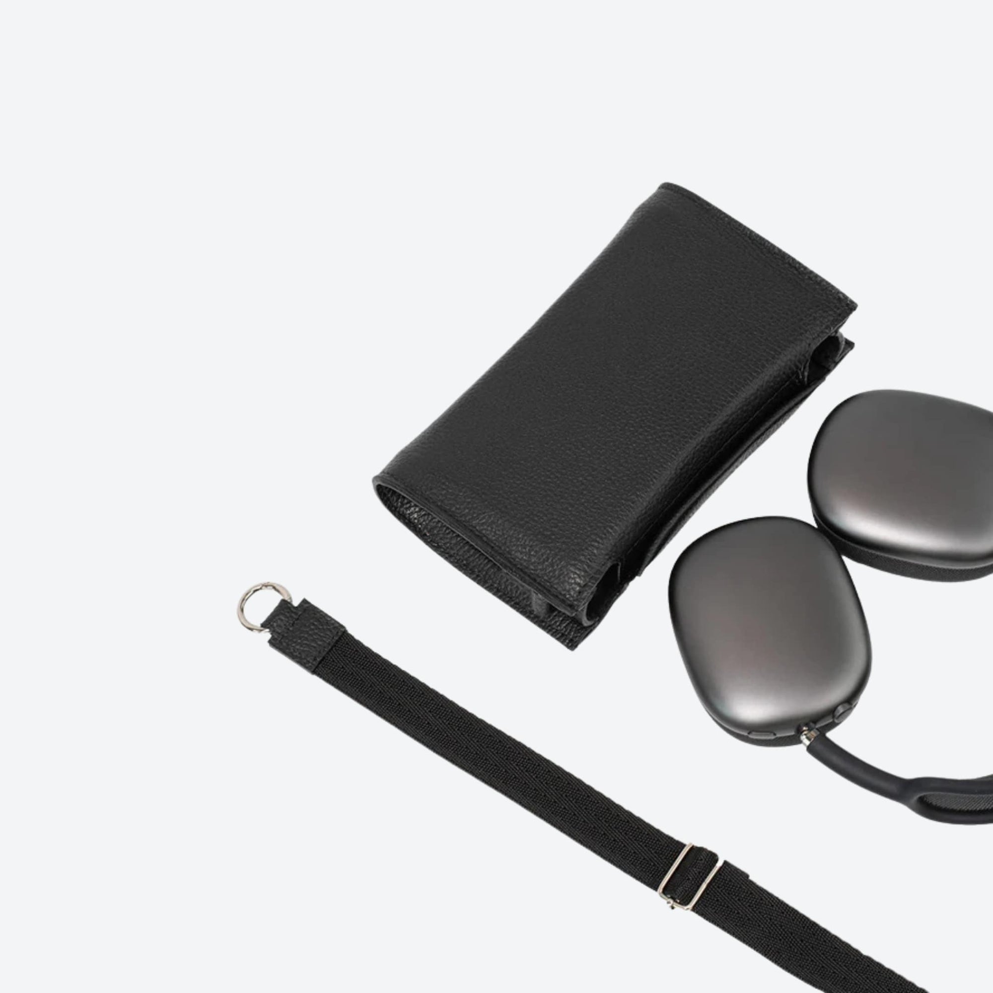 Black wallet, strap, and pouches on a light gray background