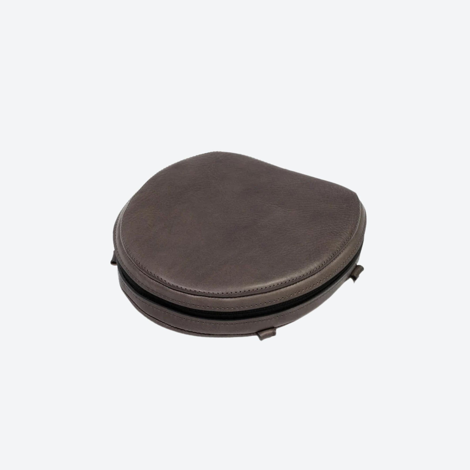 Brown leather toilet seat on a white background
