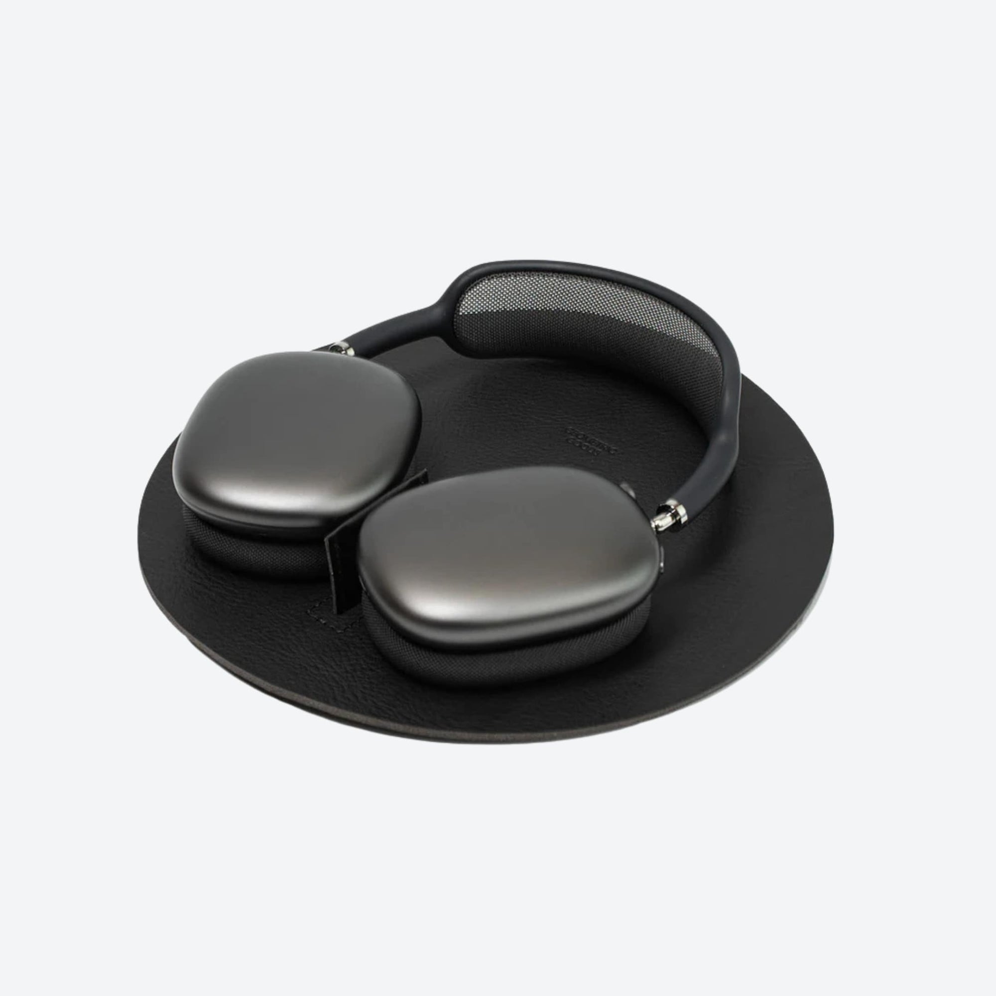 Black headphones with a carrying case on a white background