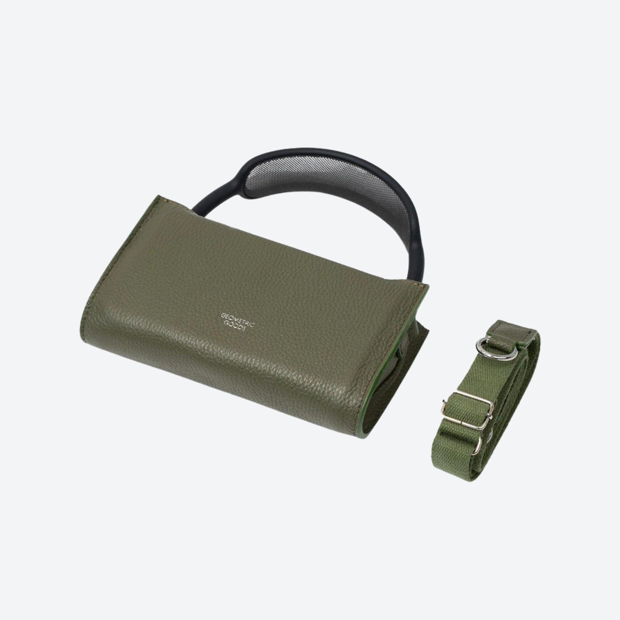 Green leather bag with a strap on a light gray background