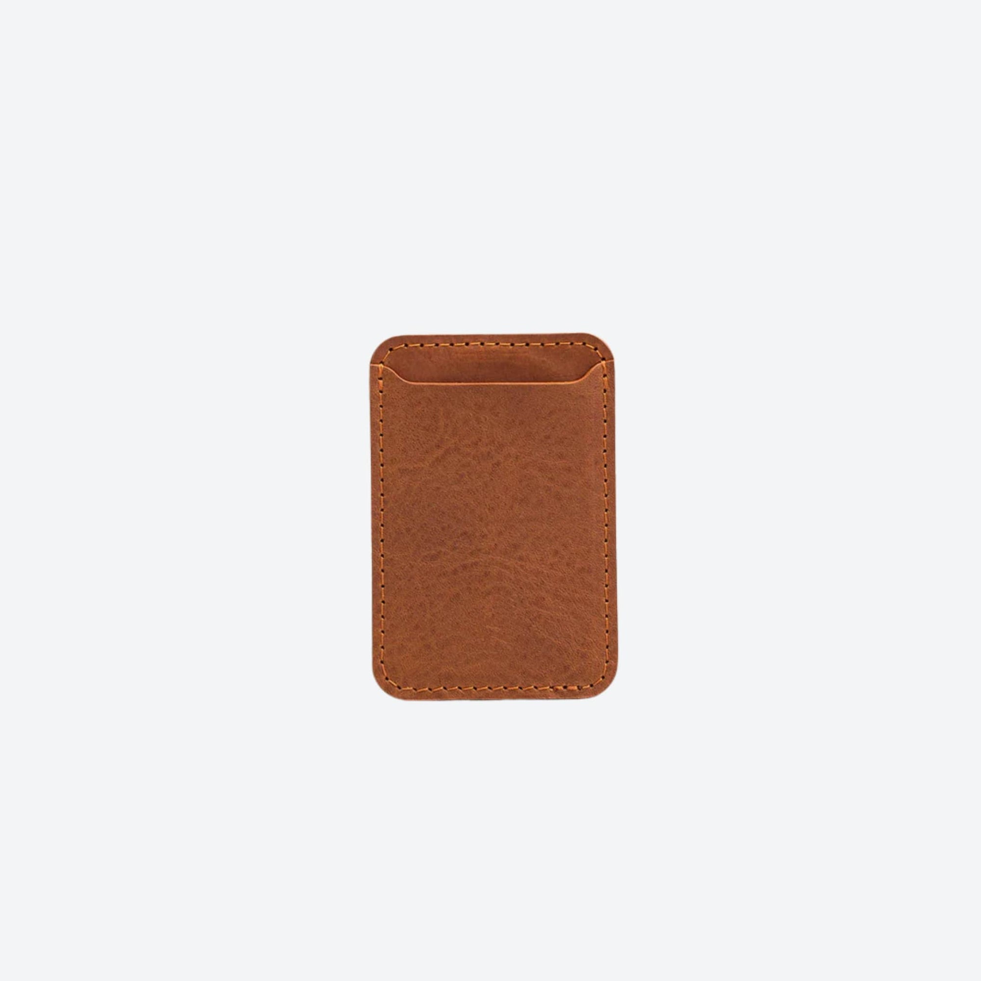 Brown leather wallet on a light beige background